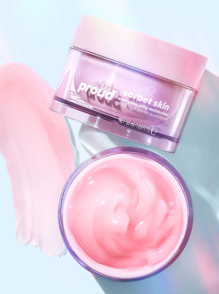 Open container of Skin Proud Sorbet Skin next to closed container