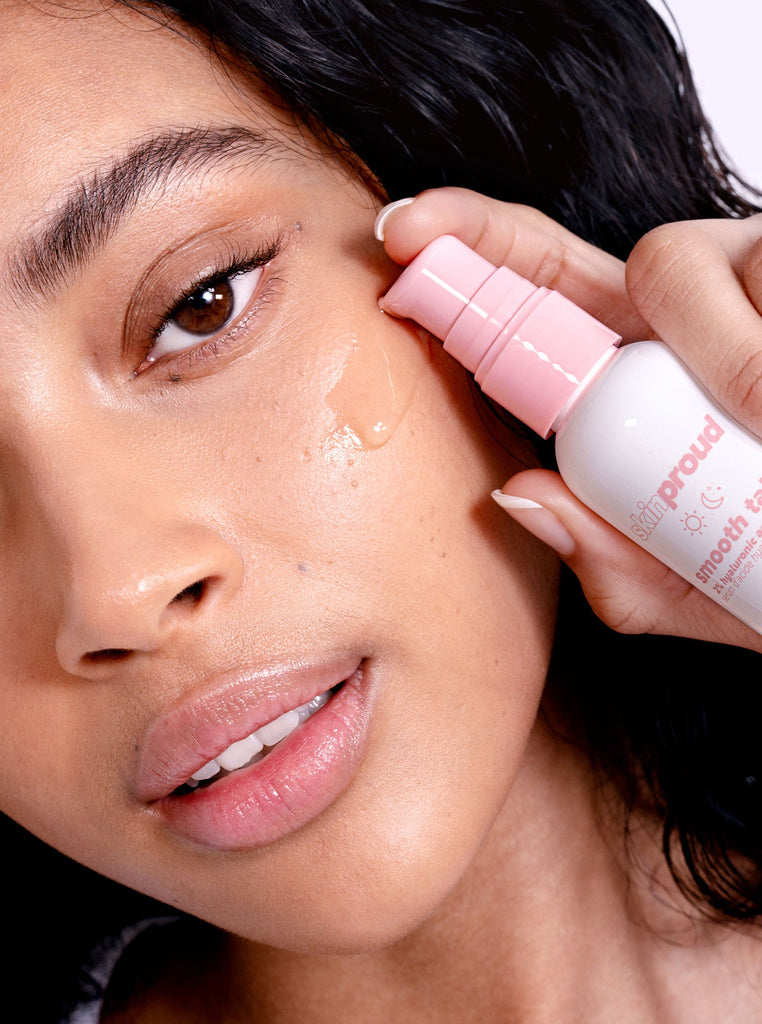 Model applying Smooth Talk serum to cheek