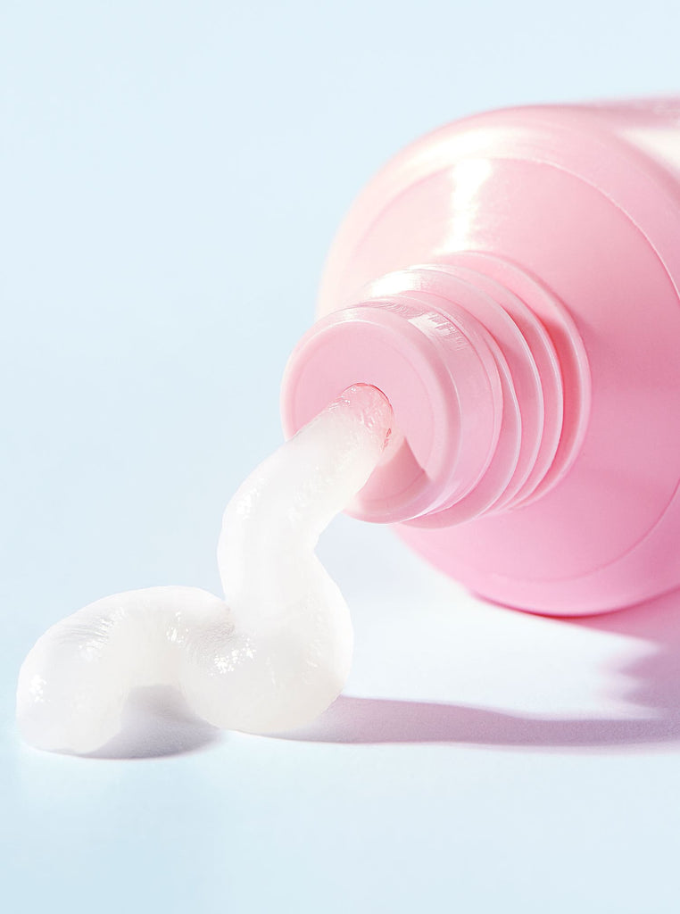 Pink tube of Everything Balm with product spilling out