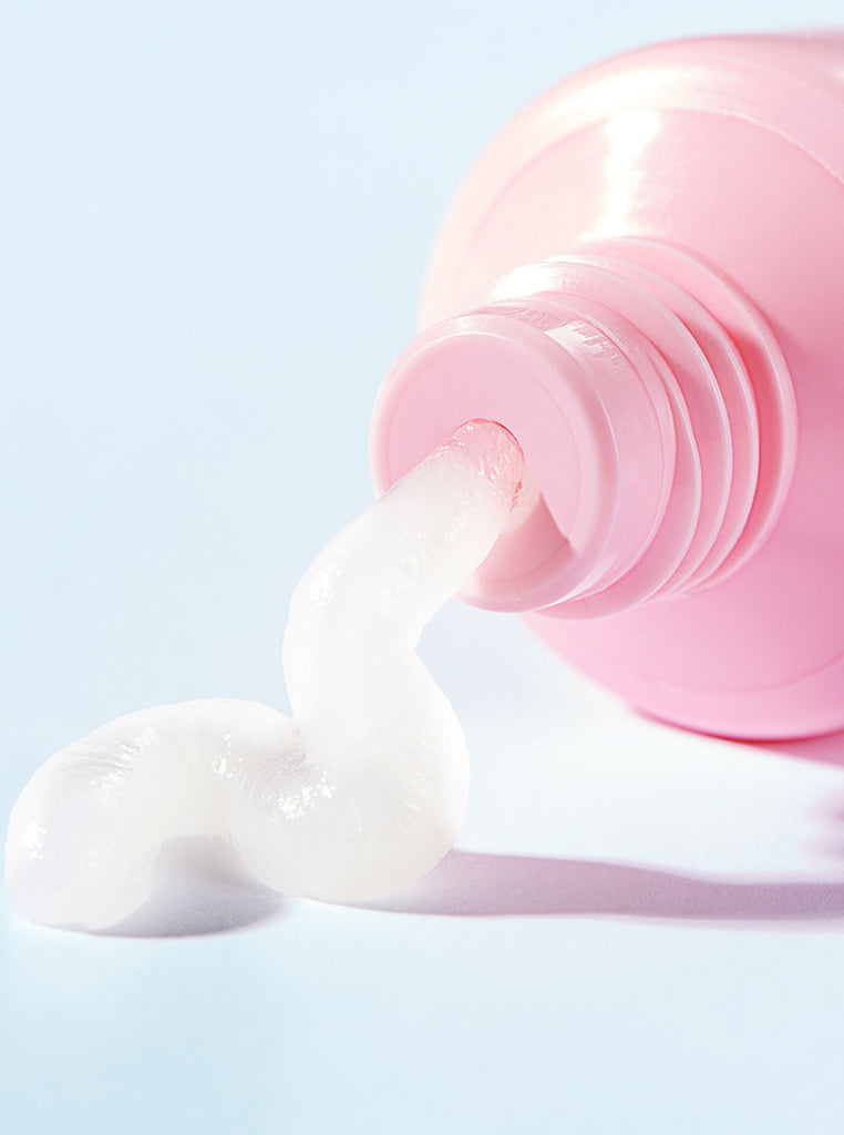 Close up pink tube with Everything Balm coming out