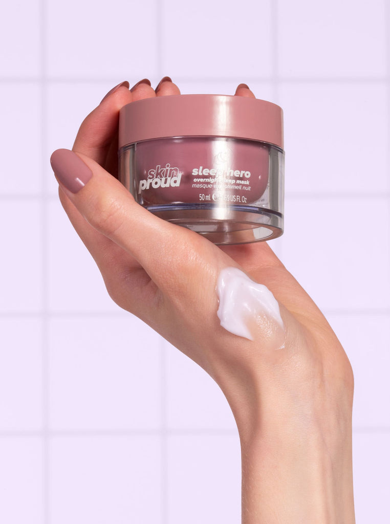 Hand holding Sleep Hero Mask with swatch on hand