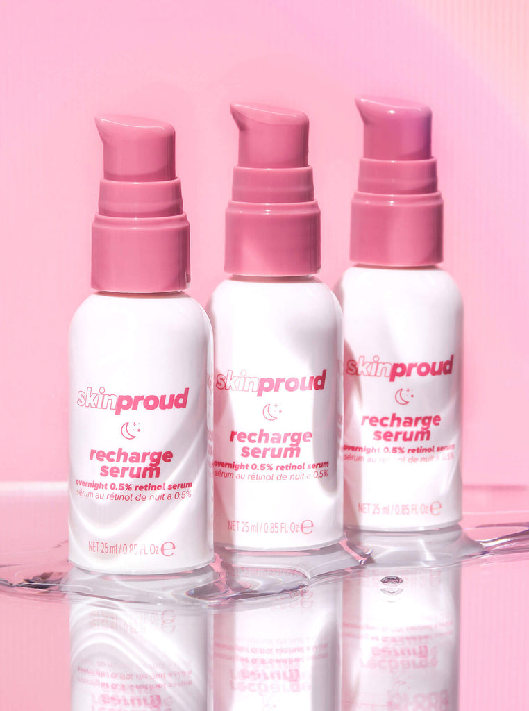 Three bottles of Skin Proud Recharge serum in a row